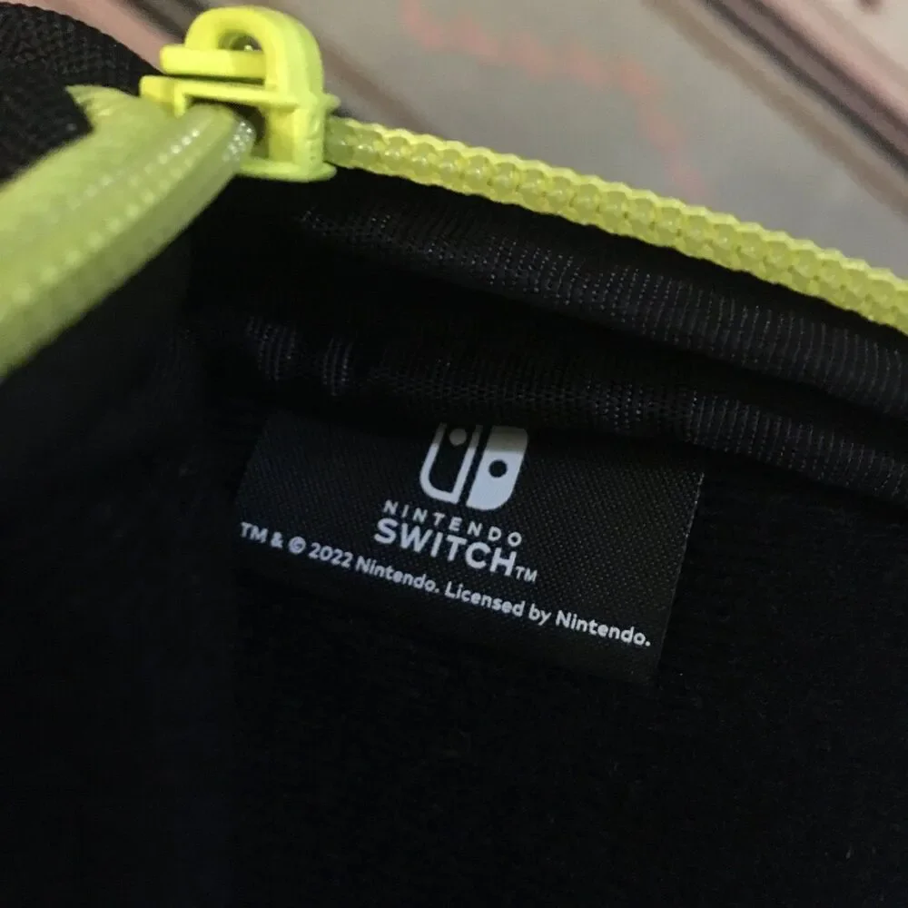 Nintendo Switch carrying case crossbody sling back blue green squids on black